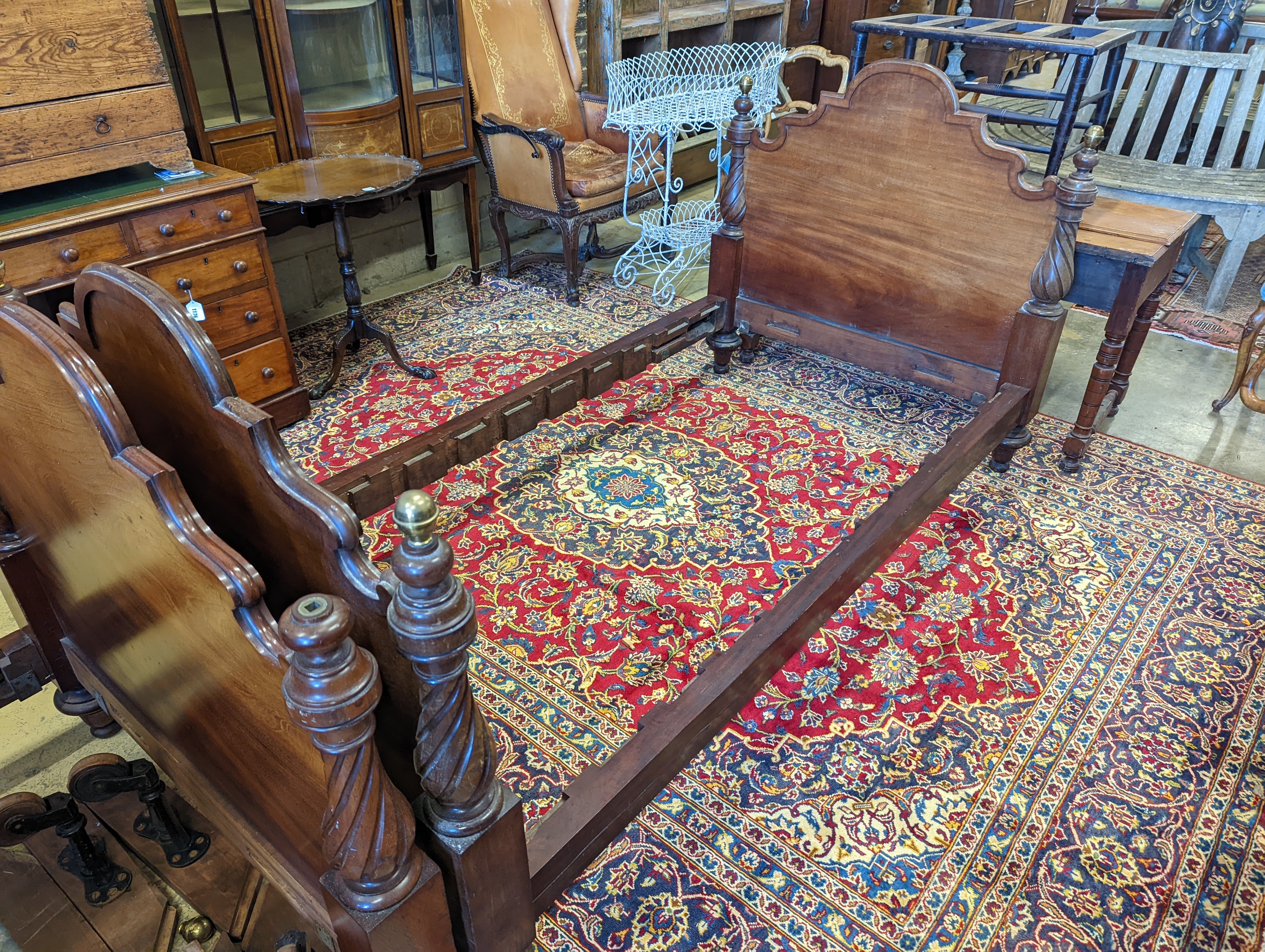 A pair of Victorian mahogany single bed frames, length 210cm, width 107cm